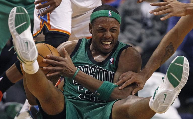 Celtics forward Paul Pierce hits the floor as he is pressured to pass against the Oklahoma City Thunder. (AP)