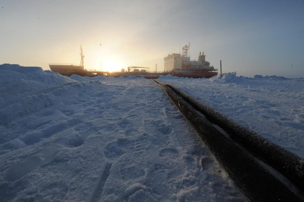 In a photo provided by the U.S. Coast Guard, two hose lines run from the Russian tanker Renda in Nome, Alaska. (AP)