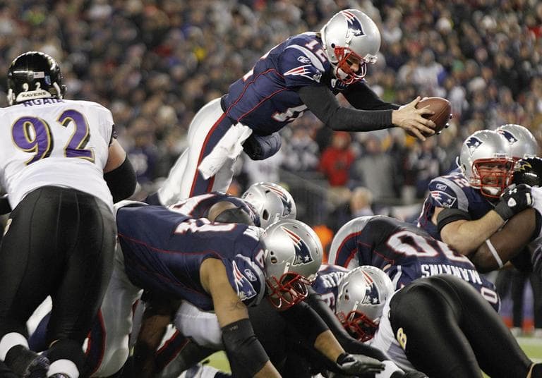 New England Patriots quarterback Tom Brady (12) dives over the middle to score on a one yard run against the Baltimore Ravens during the second half of the AFC Championship NFL football game  Sunday. (AP)