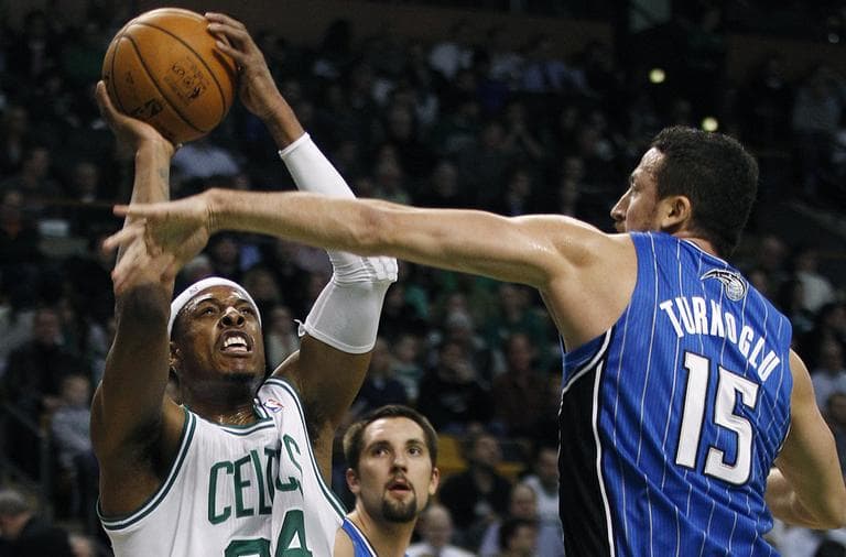 Boston Celtics small forward Paul Pierce shoots as Orlando Magic forward Hedo Turkoglu reaches to block during the first quarter in Boston, Monday. (AP)
