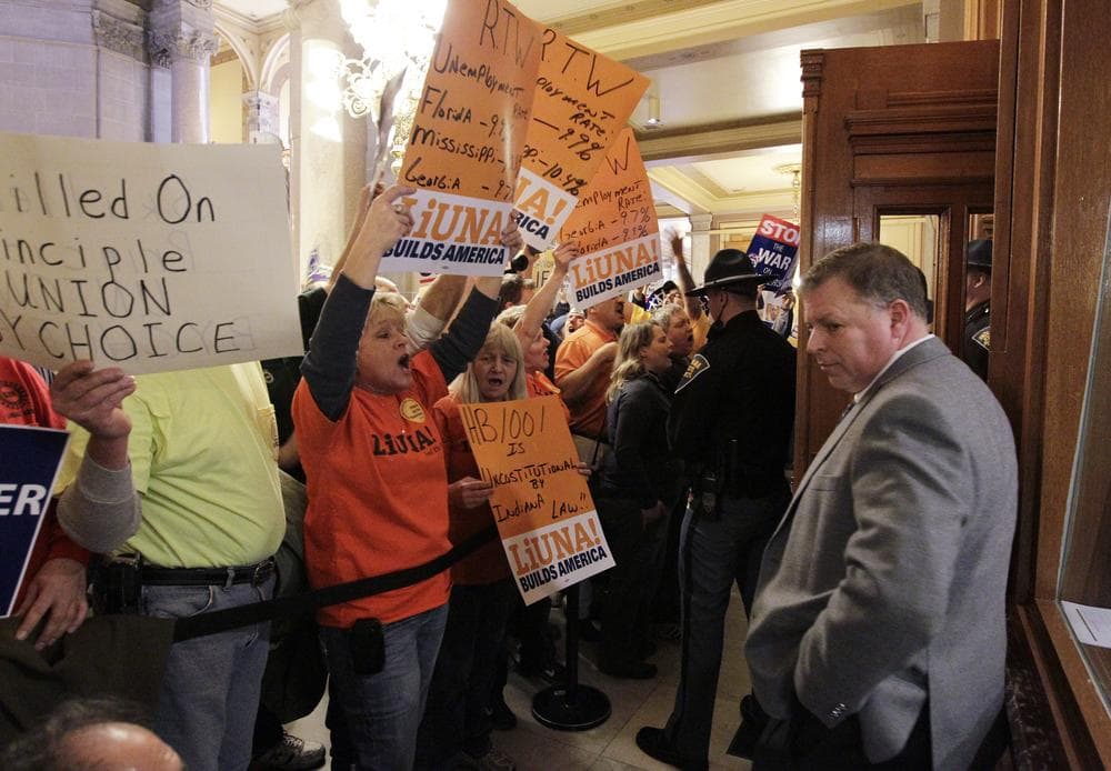 Rep. Scott Reske, D-Pendleton, stands outside of the House of Representatives during a debate on the right to work bill at the Statehouse Wednesday in Indianapolis. (AP)