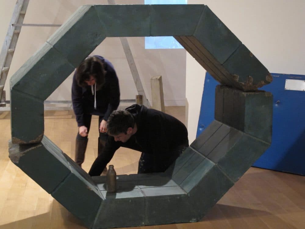 Curator Dina Deitsch with one half of Antoniadis and Stone (Andrea Shea/WBUR)