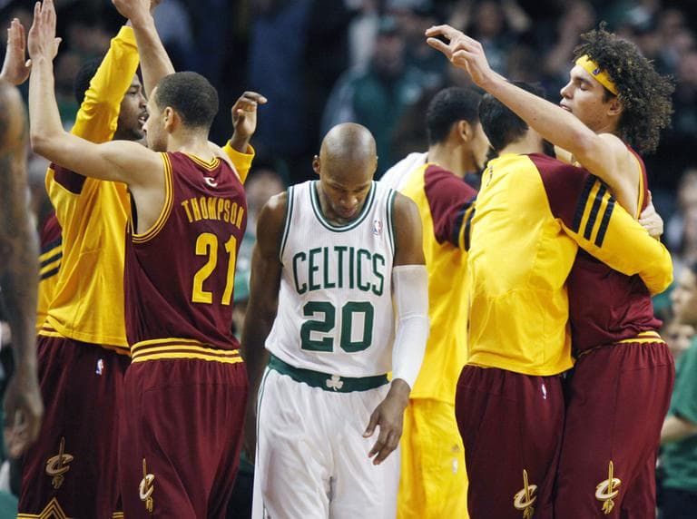 Boston Celtics' Ray Allen heads off the court as the Cleveland Cavaliers Anderson Varejao, right, and Mychel Thompson celebrate the Cavaliers' 88-87 win in Boston, Sunday. (AP)