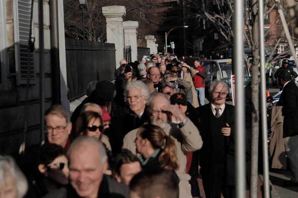 Line of people extending down Beacon Street past the State House (Jesse Costa/WBUR)