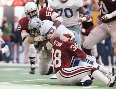 In this Nov. 14, 1983, file photo, Dallas Cowboys running back Tony Dorsett (33) is stopped after a two-yard gain in an NFL football game in Irving, Texas. (AP)