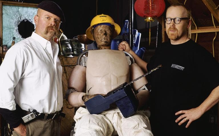 Jamie Hyneman, left, "Buster" the crash-test dummy and Adam Savage, right, during a segment of the Discovery Channel's show "Mythbusters." (AP)