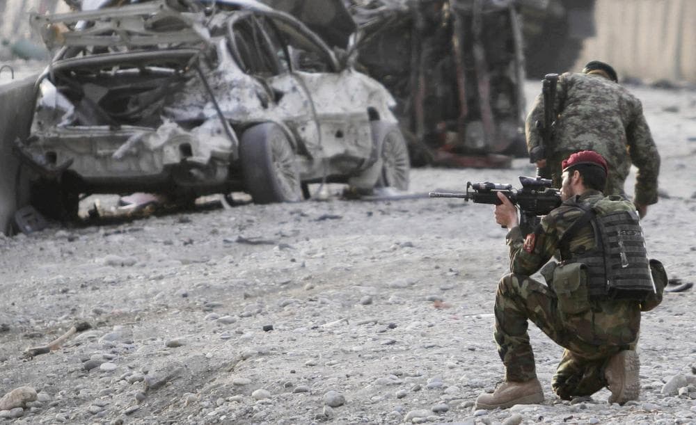 An Afghan soldier secures the scene of a suicide attack at the gate of an airport in Jalalabad, Nangarhar province east of Kabul, Afghanistan on Monday. (AP)