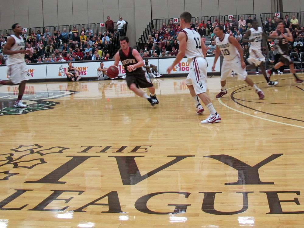 Brown's Sean McGonagill thinks maybe he won't try to penetrate Harvard's defense after all. (Bill Littlefield/Only A Game)