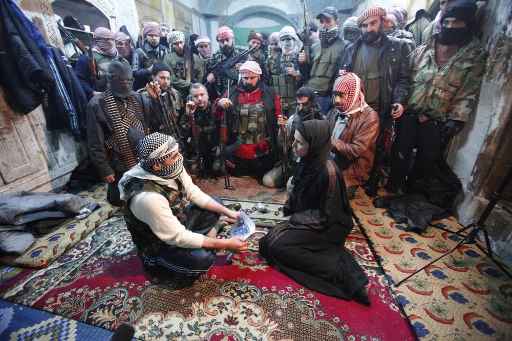 CBS News foreign correspondent Clariss Ward interviews rebel fighters in Syria, Feb. 2012. 