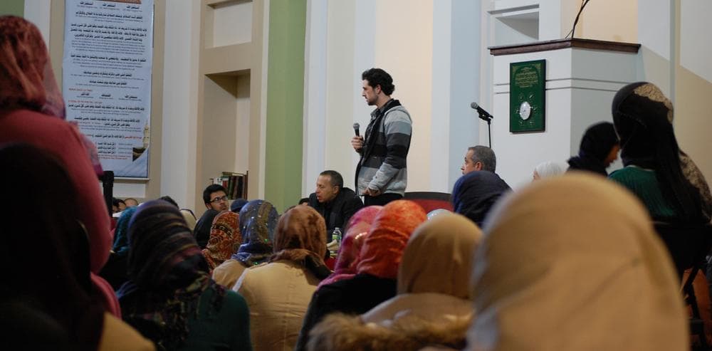 Syrian activist Danny Abdul Dayem, speaking at the Islamic Society of Boston Cultural Center in Boston. (Jill Ryan/Here & Now)