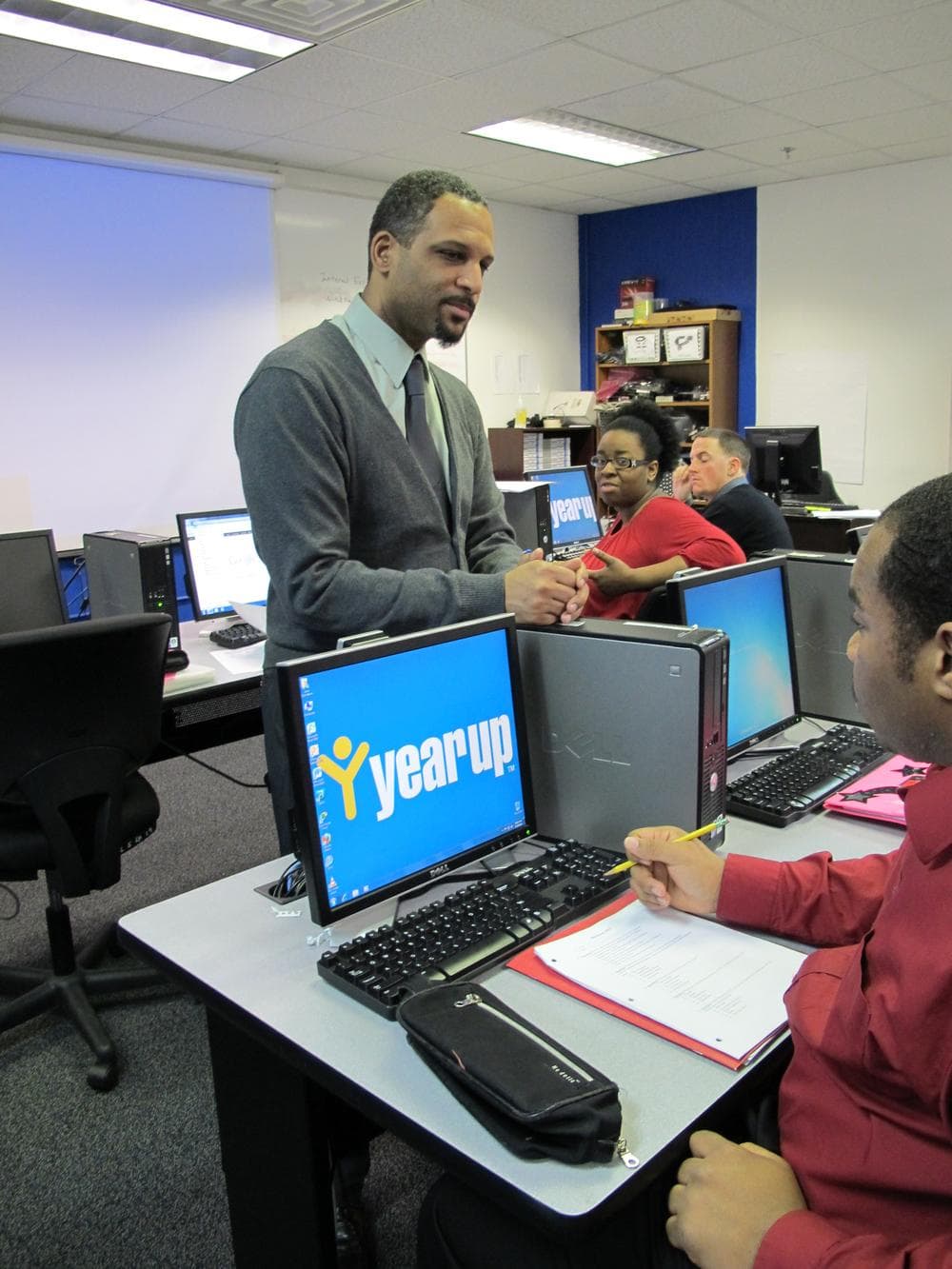 Peter Bos teaching a computer basics class at Year Up Boston. (Monica Brady-Myerov/WBUR)