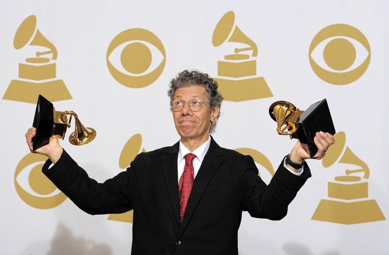 Chick Corea poses with the awards for best improvised jazz solo for "500 Miles High" and best jazz instrumental album for "Forever" at the 54th annual Grammy Awards on Sunday, Feb. 12, 2012 in Los Angeles. (AP)