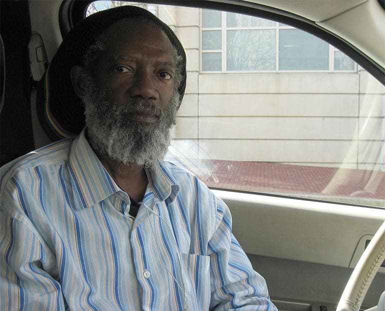 Pierre Duchemin is a lead plaintiff in a class-action lawsuit filed against the City of Boston and three area cab companies. He says he often makes only a "pittance" after he pays fees to cab companies as an independent contractor and wants to be classified as an employee instead. (Beenish Ahmed for WBUR)