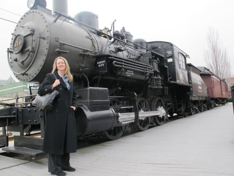 UMass professor, Dickens scholar and exhibit curator Diana Archibald at the train station in Lowell where Dickens arrived in 1842. (Andrea Shea/WBUR)