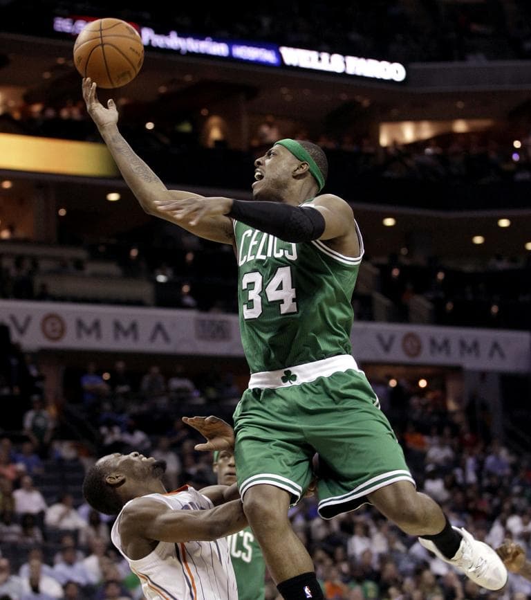 Boston Celtics' Paul Pierce drives over Charlotte Bobcats' Kemba Walker in the second half of an NBA basketball game in Charlotte, N.C., Monday. (AP)