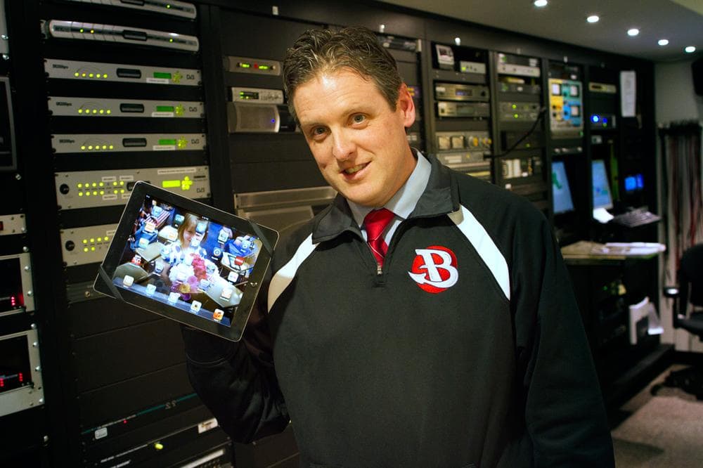 Burlington High School Principal Patrick Larkin shows off his iPad at Here &amp; Now studios at WBUR in Boston. (Jesse Costa/Here &amp; Now)