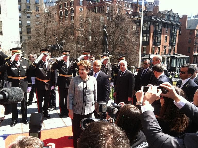 Brazilian President Dilma Rousseff, left, stands in front of Gov. Deval Patrick at the State House, Tuesday. (Fred Thys/WBUR)
