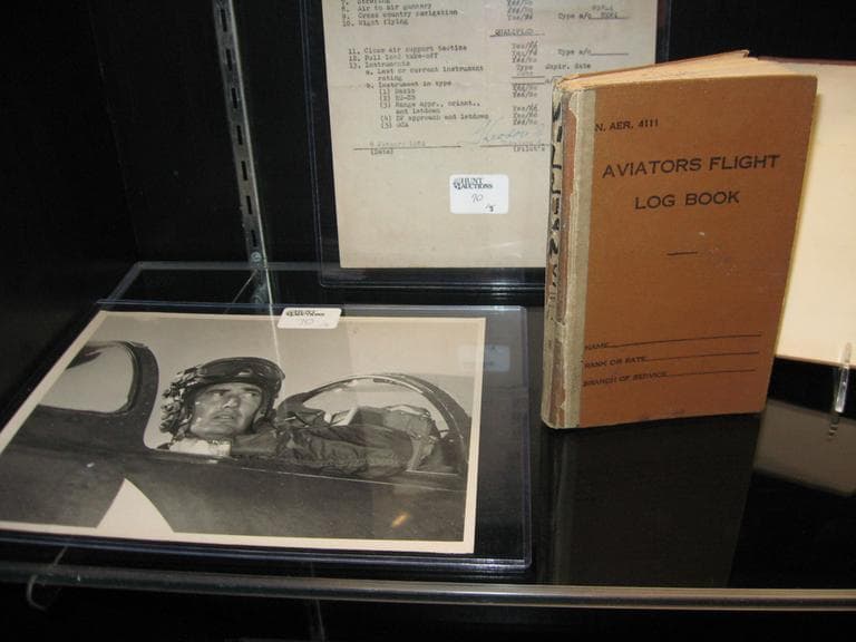  Some of Williams’ military mementos, including a book in which he logged his flights during World War II and the Korean War. (Lynn Jolicoeur for WBUR)
