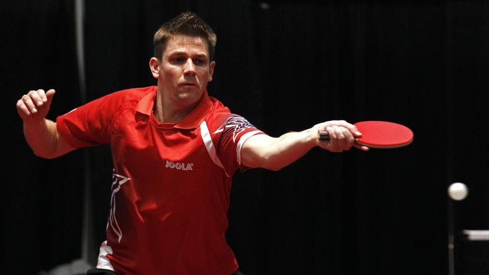 Barney Reed returns a shot during a semifinal match of the North American table tennis Olympic Trials. (AP)