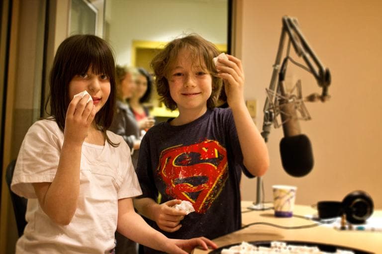 Jamie Wolpert (left) and Sammy Haines (right) test some marshmallows for us at Here & Now studios at WBUR in Boston. (Jesse Costa/Here & Now)