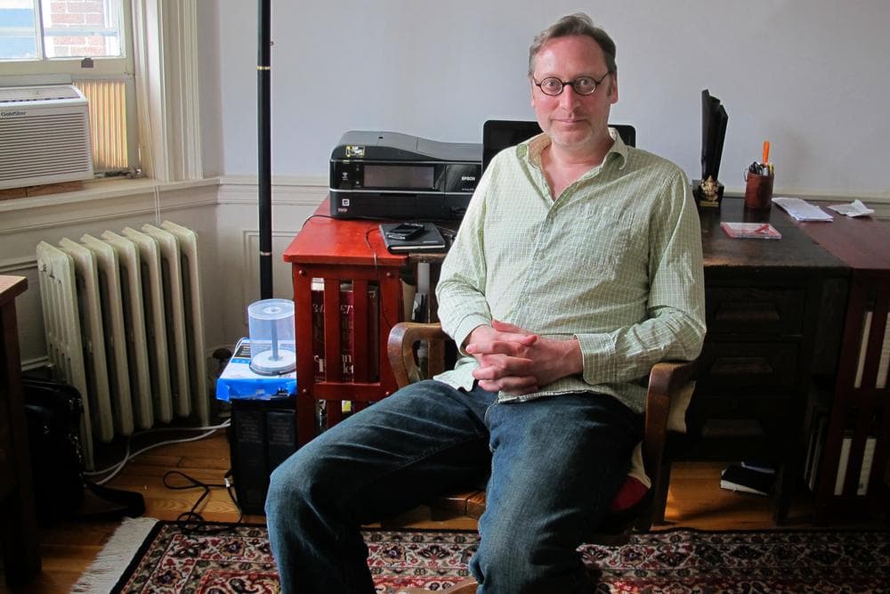 Cambridge author M.T. Anderson at his writing desk (Adam Ragusea/WBUR)
