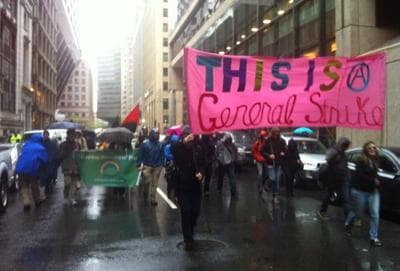 Occupy Boston members march through Boston's Financial District early Tuesday. (Todd Kazakiewich/WCVB-TV via Twitter)