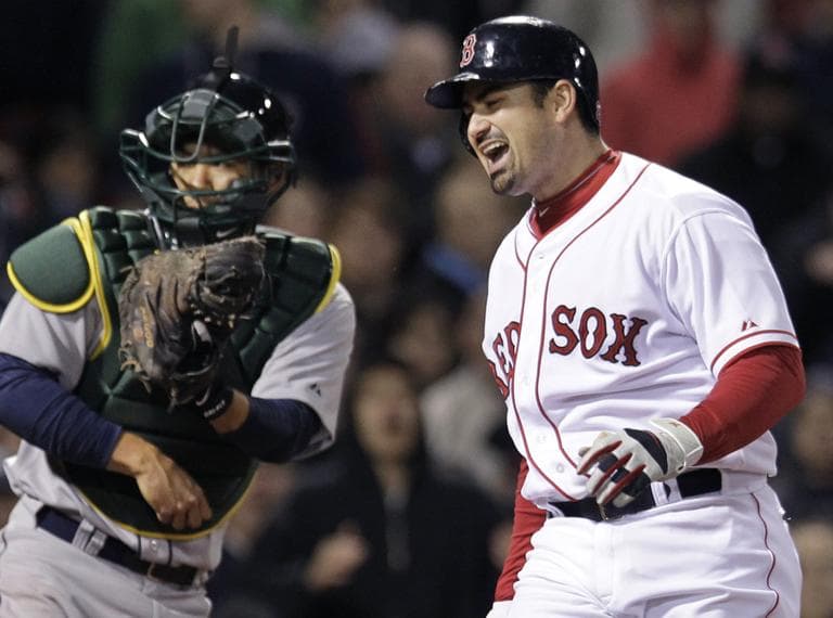 Boston Red Sox's Adrian Gonzalez yells after striking out and leaving the bases loaded in the seventh inning against the Oakland Athletics on Wednesday. (AP)