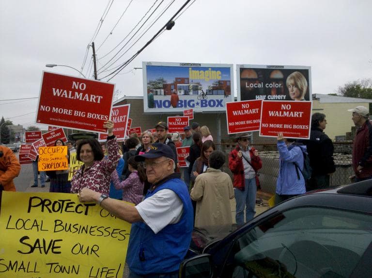 "Sustainable Watertown" unveils their new billboard which reads "Imagine... no big box." (WBUR/Lynn Jolicoeur)