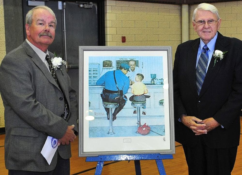 Dick Clemens, right, who posed as the trooper, and Ed Locke, who posed as the boy, stand with Norman Rockwell's "The Runaway" during the 50th anniversary celebration of the painting in 2008 at State Police headquarters. (State Police)