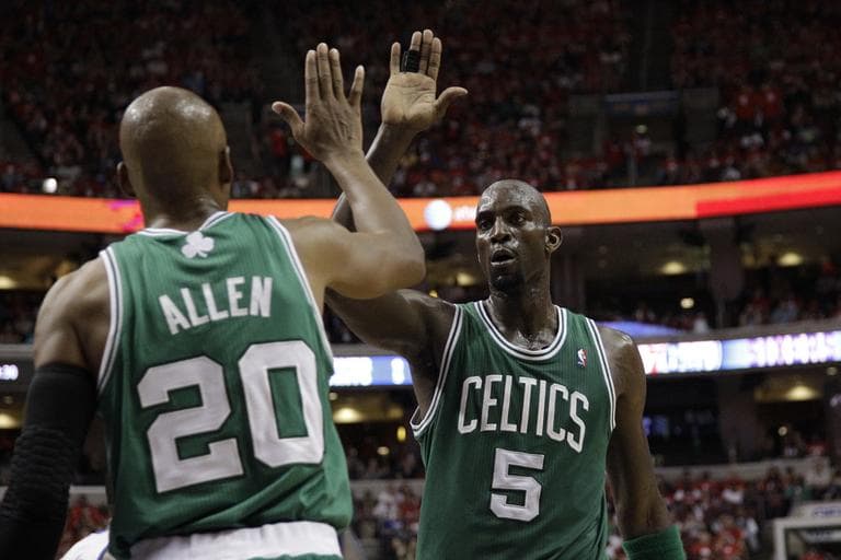 Kevin Garnett high fives Ray Allen during the first half of Game 3 of the Eastern Conference semifinal playoff series in Philadelphia. (AP)