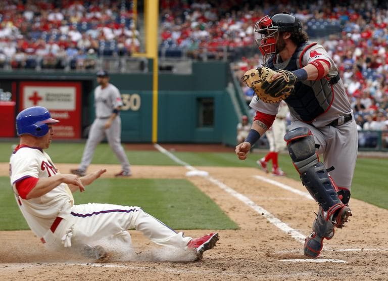 Red Sox catcher Jarrod Saltalamacchia, right, gets out of the way as Philadelphia Phillies' Pete Orr slides safely into home. (AP)