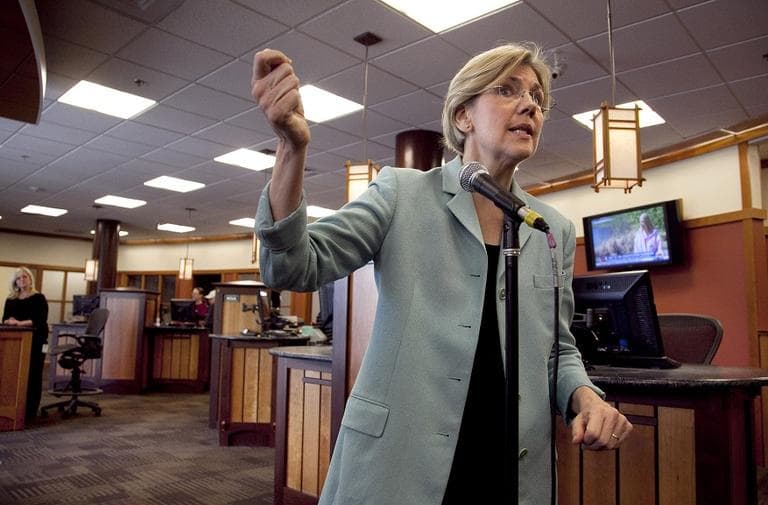 Elizabeth Warren responds to questions from reporters on her Native American heritage during a news conference at Liberty Bay Credit Union headquarters, in Braintree, Mass. in May. (AP Photo/Steven Senne)