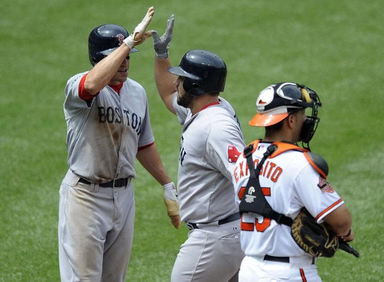 Boston Red Sox's Kelly Shoppach, center, celebrates his two-run home run with teammate Scott Podsednik, Wednesday. (AP)