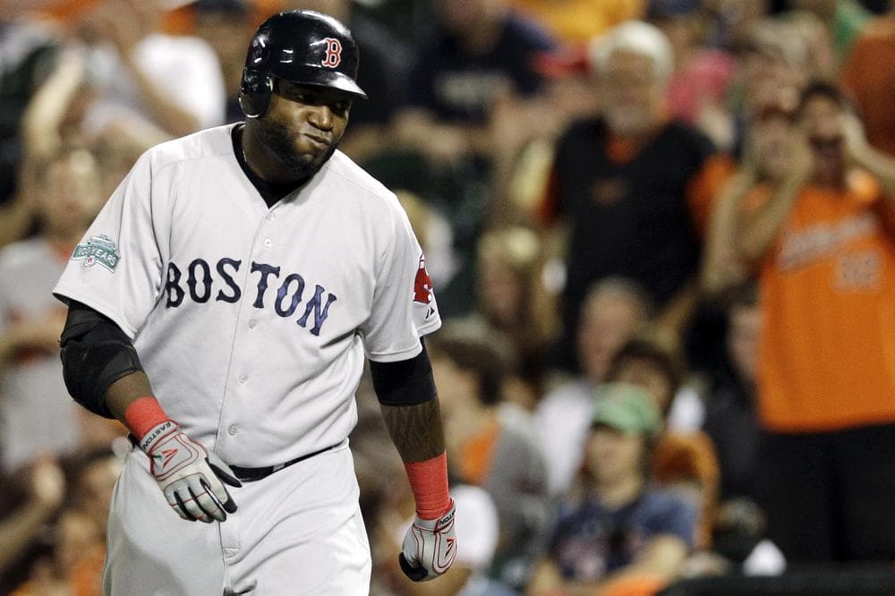 Designated hitter David Ortiz walks back to the dugout after grounding out in the ninth inning against the Orioles last night in Baltimore.