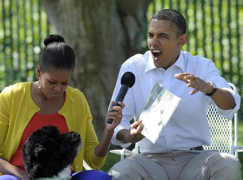 President Barack Obama, accompanied by first lady Michelle Obama, and first dog Bo, reads "Where the Wild things Are" during the annual White House Easter Egg Roll, Monday, April 9, 2012, on the South Lawn of the White House in Washington. Author Maurice Sendak died this week. (AP)