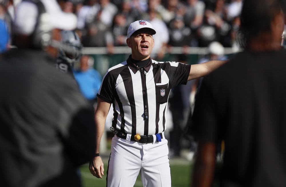 The NFL is set to begin hiring replacement officials because contract talks with the referees' union have stalled. The NFL Players Association opposes the move. (AP)