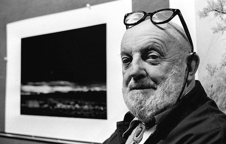 Photographer Ansel Adams poses with his famous photograph, "Moonrise," in this undated photo. (AP)