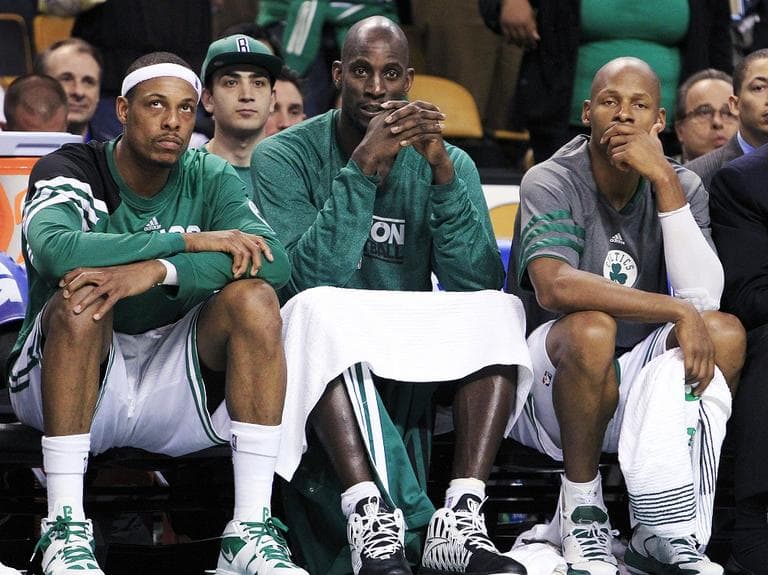 Celtics' Paul Pierce, Kevin Garnett and Ray Allen sit on the bench near the end of the fourth quarter in Game 6. (AP Photo/Elise Amendola)