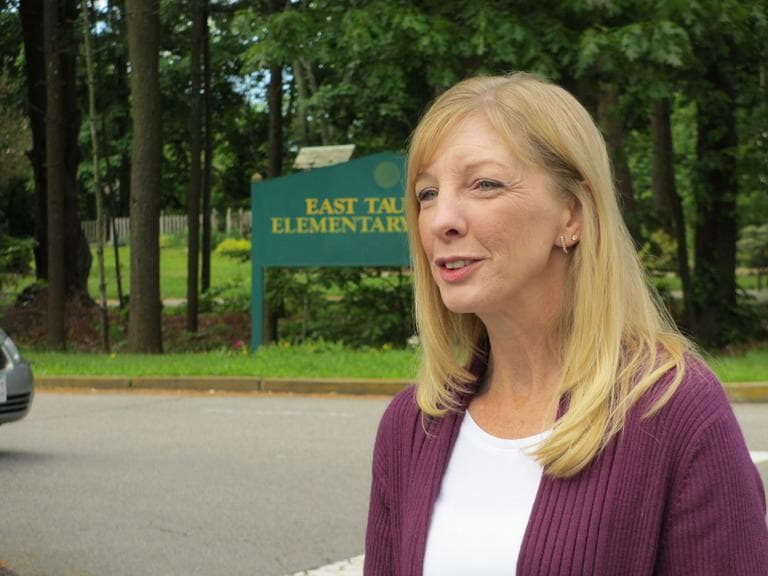 Michelle Littlefield of Preserving Taunton's Future stands outside the East Taunton Elementary School, about 300 feet from the proposed casino site. (Kathleen McNerney/WBUR)