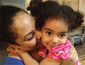 Tracy DeJesus and her daughter, Giannie, who was diagnosed with juvenile diabetes (Martha Bebinger/WBUR)