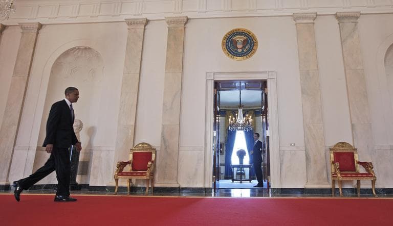 President Barack Obama walks back to the Blue Room of the White House Thursday after the Supreme Court ruled on his health care legislation. (AP)