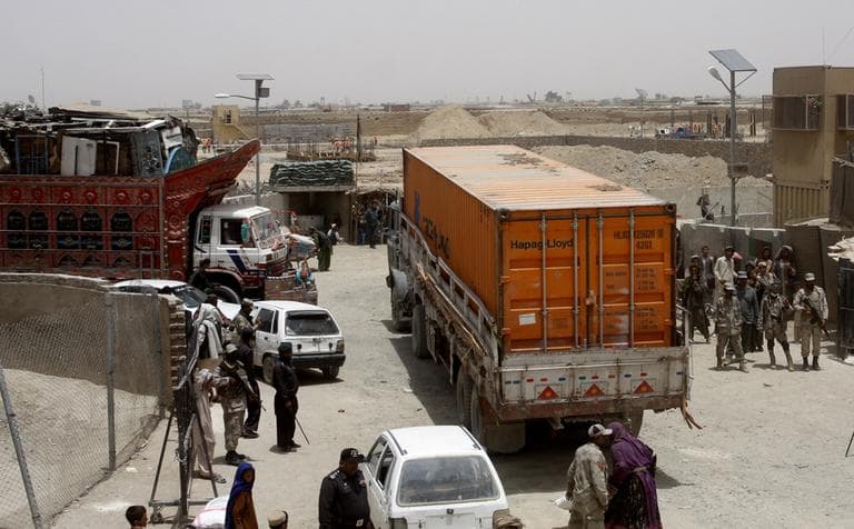 Pakistani border guards stand alert at the Pakistan-Afghanistan border in Chaman, Pakistan, Thursday, July 5. The first truck carrying supplies to American and NATO troops in Afghanistan has crossed the Pakistani border after a seven-month long closure of the supply routes by Pakistan ended earlier this week. (AP)