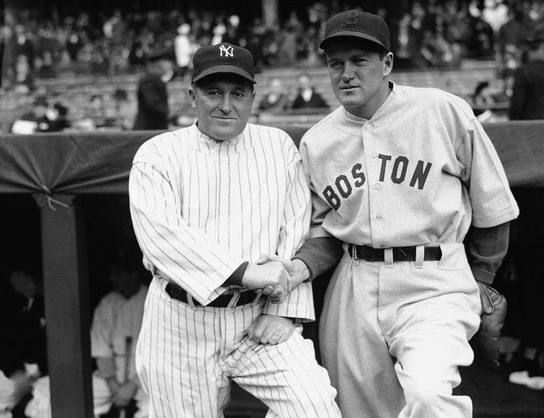 Joe McCarthy, left, manager of the New York Yankees, and Joe Cronin, big chief of the Boston Red Sox, are shown just before their teams met, April 16, 1935 in Yankee Stadium, New York, before a crowd of 40,000. (AP Photo)