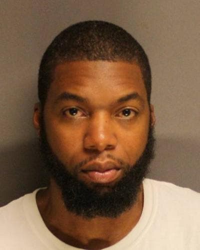 Rep. Carlos Henriquez, in his booking photo (Suffolk DA)
