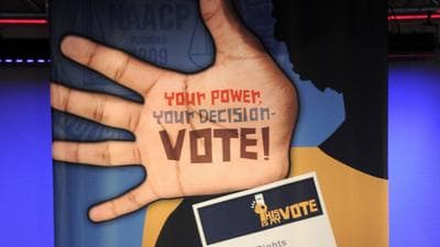 A sign at the NAACP annual convention in Houston, where Mitt Romney is scheduled to speak on Wednesday. (AP)