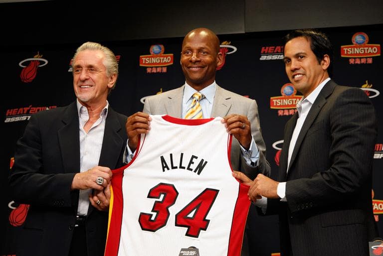 From left: Miami Heat president Pat Riley, Ray Allen and head coach Erik Spoelstra hold up Allen's jersey after the former Celtic signed a contract with the Heat Wednesday. (AP)