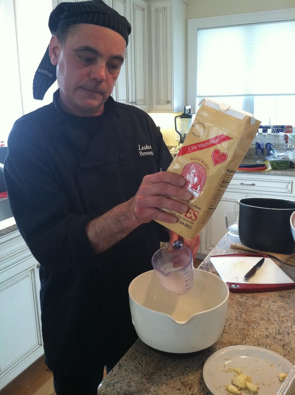 Personal Chef Lester Esser at work in Nate Solder's kitchen.  (Karen Given/WBUR)