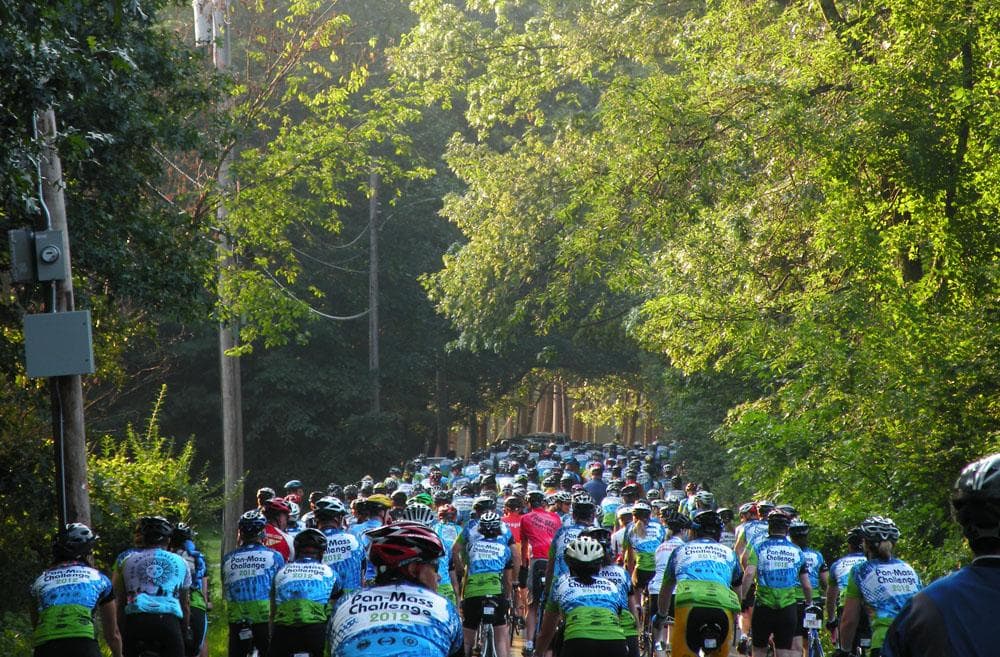 Riders leave Babson College campus for the first leg of the PMC. (Abby Elizabeth Conway for WBUR)