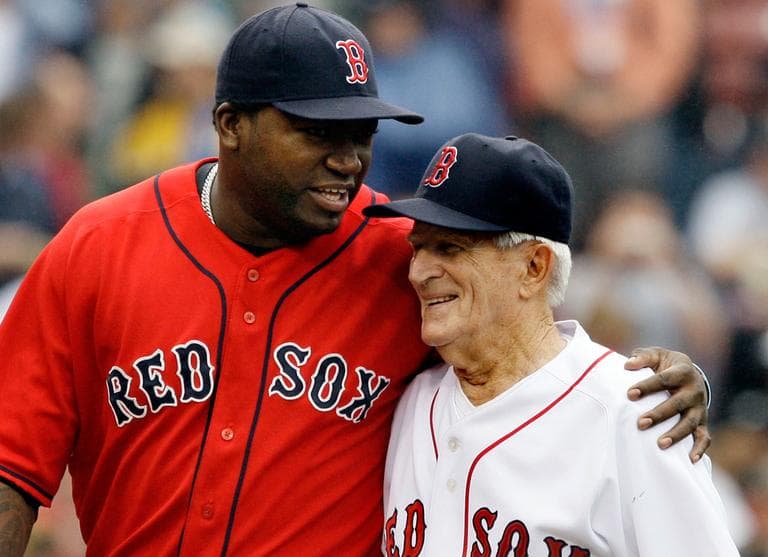 DH David Ortiz, left, hugs Sox legend Johnny Pesky during ceremonies retiring Pesky's No. 6 at Fenway Park, Sept. 28, 2008. (AP)