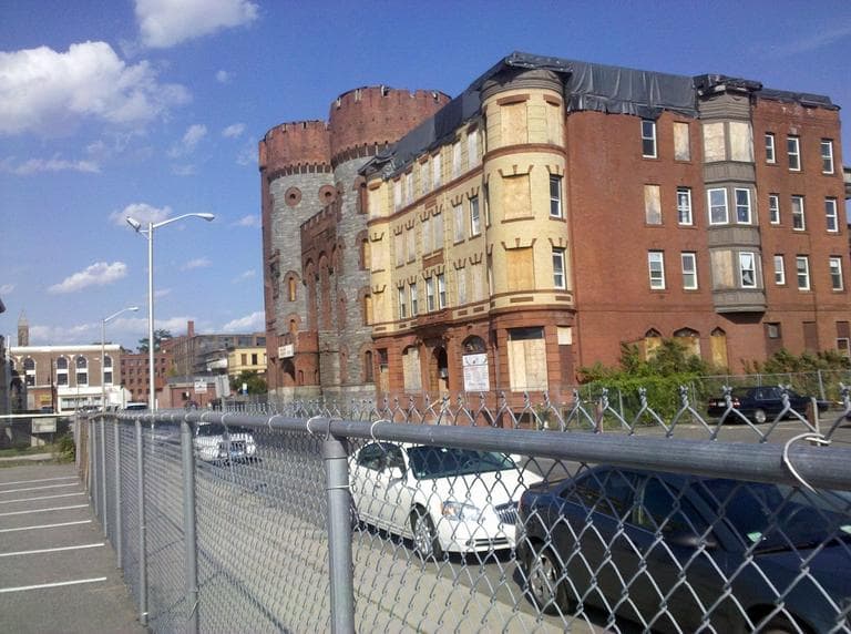 Two tornado-damaged buildings in the development area, including an old armory building MGM says it wants to preserve (Lynn Jolicoeur/WBUR)